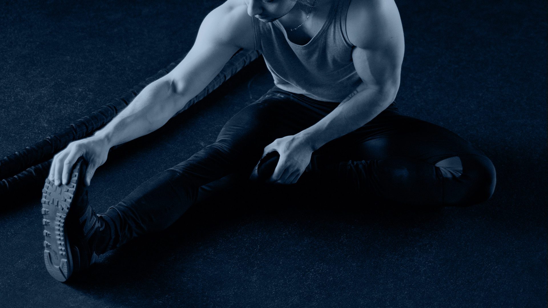 man stretching legs after workout in gym at Radisson Blu Athlone