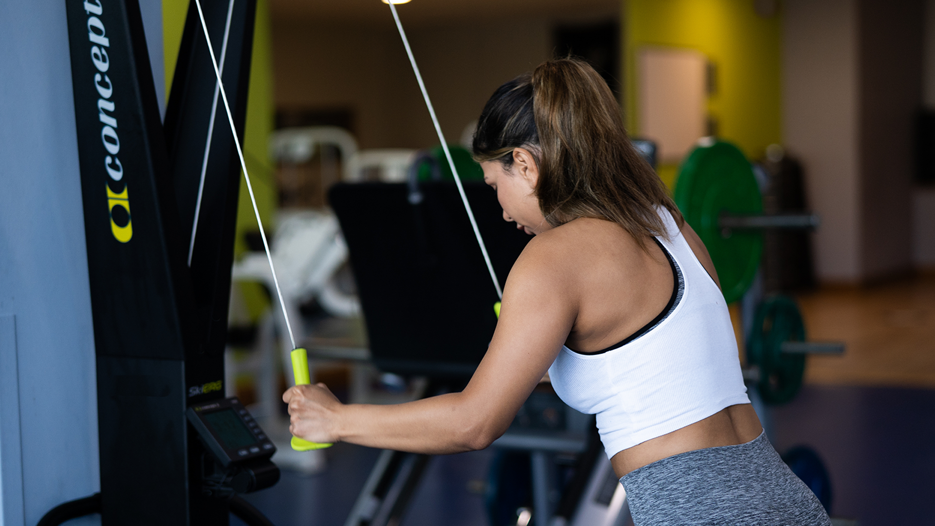Woman using cable machine for upper body workout at Radisson Blu Hotel Athlone gym.